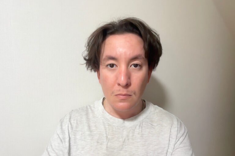 Portrait of Jasmin Louis-Seize with short brown hair and neutral expression.