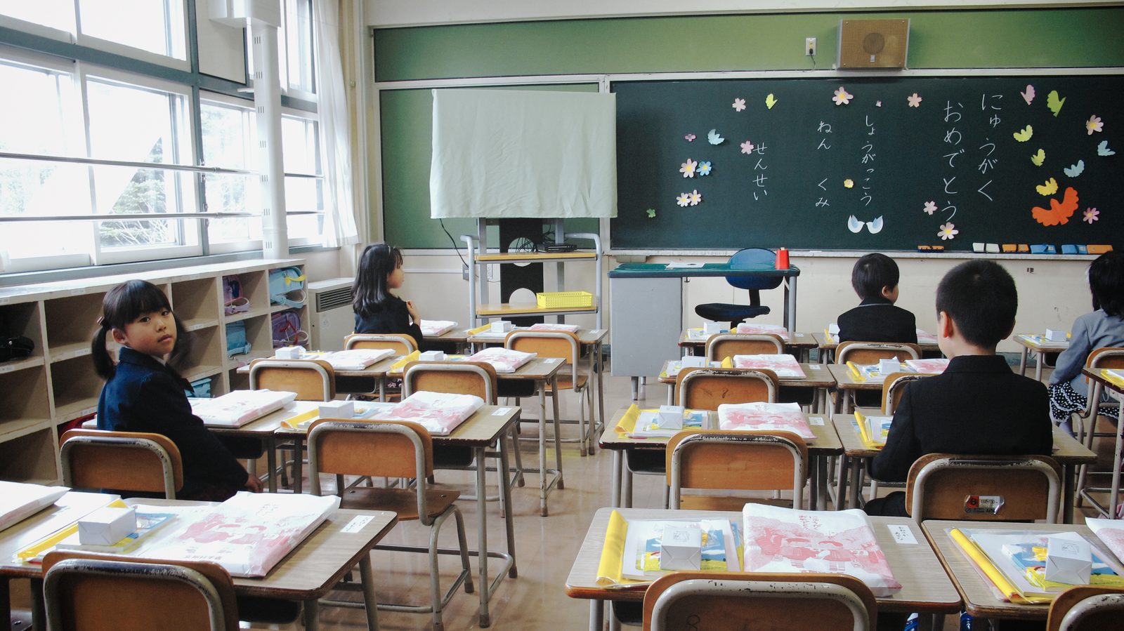 A bright primary school classroom with children at their desks