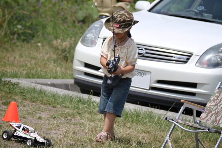 A child steering a remote-controlled car